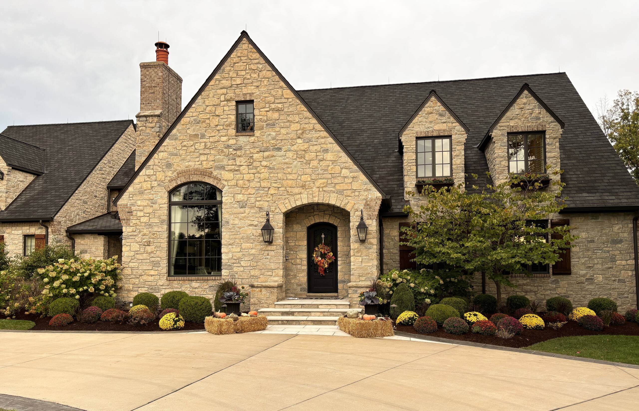 Seasonal accents like hay bales, cornstalks, and fall foliage