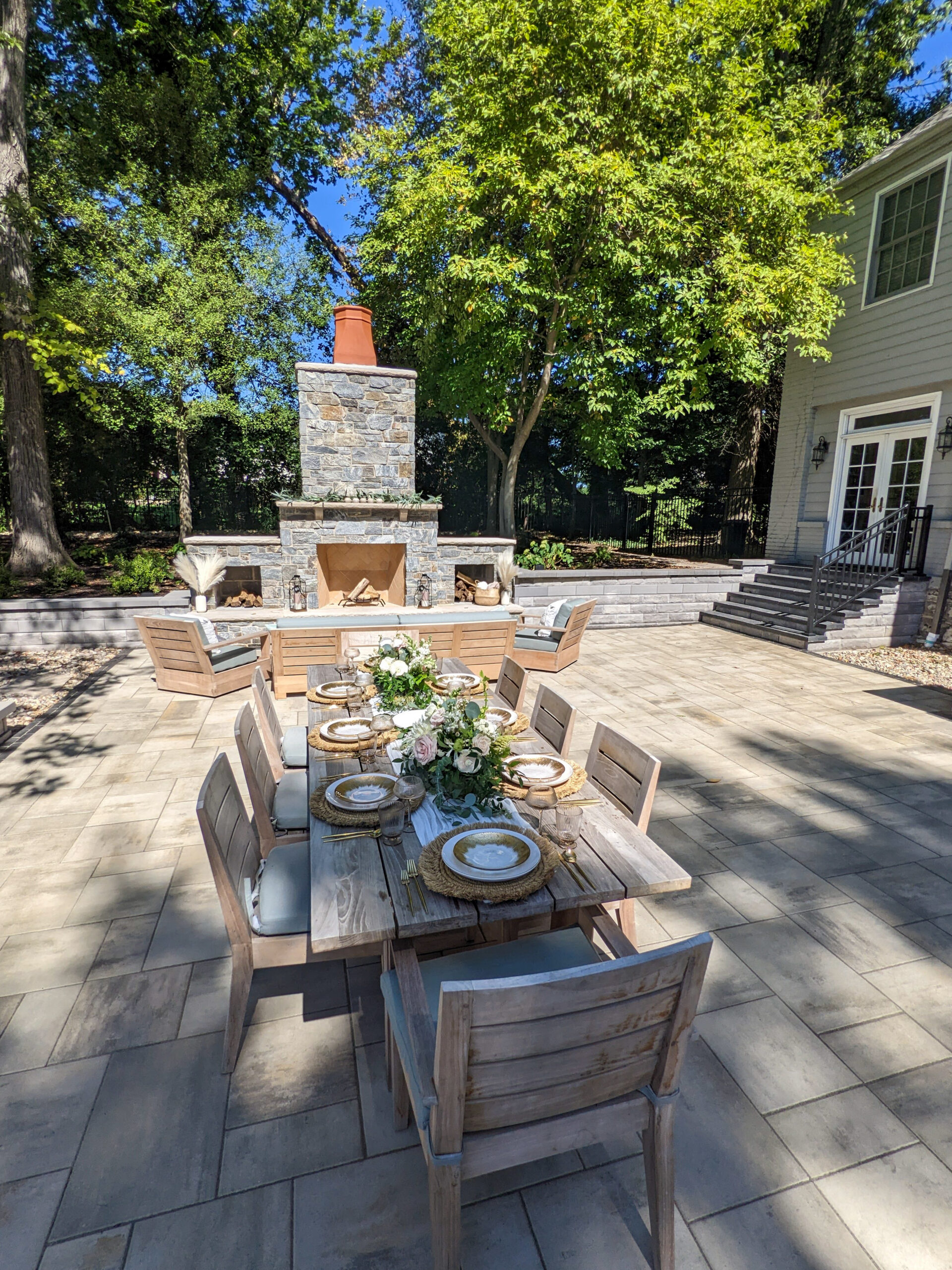 Outdoor kitchen and fire feature in one frame, evening light