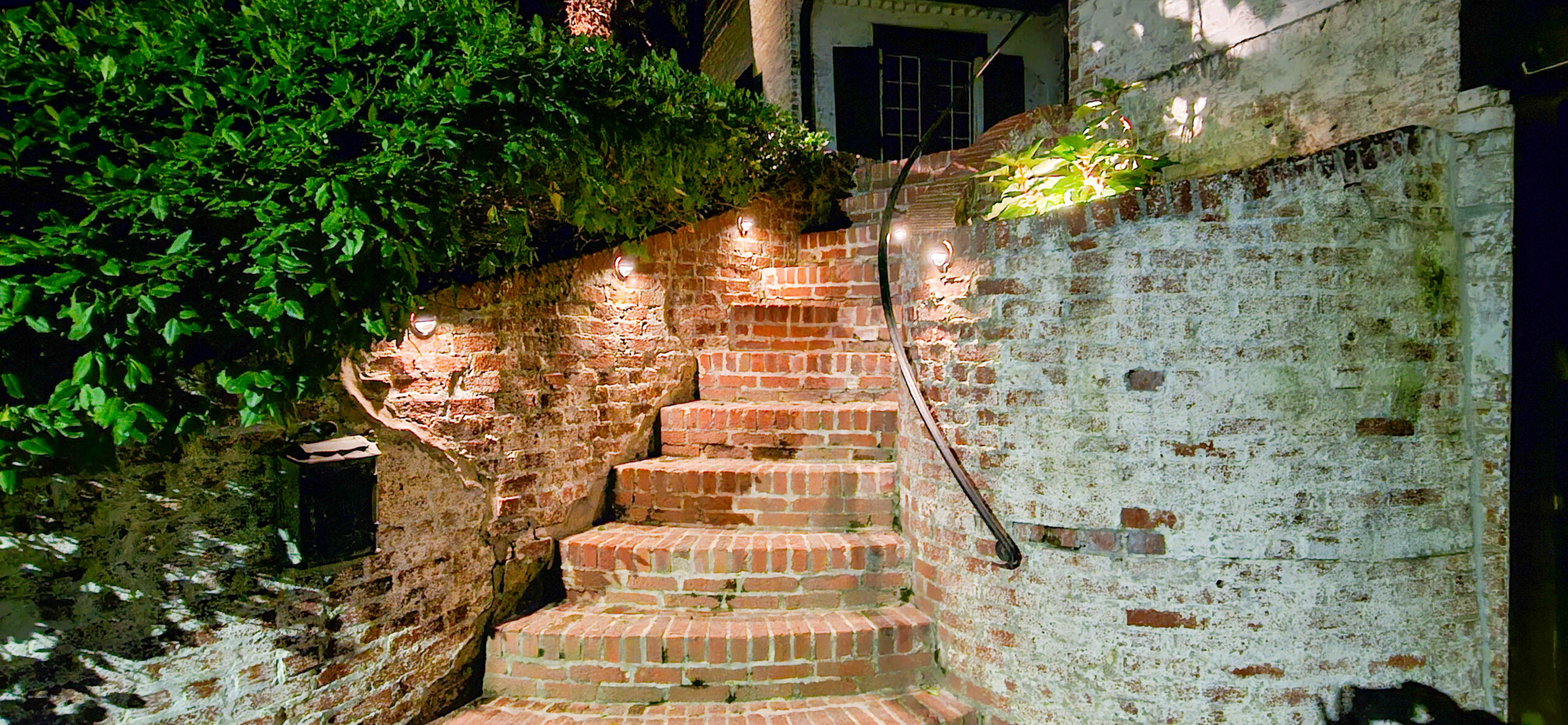 Landscape lighting on a St. Louis property after dark